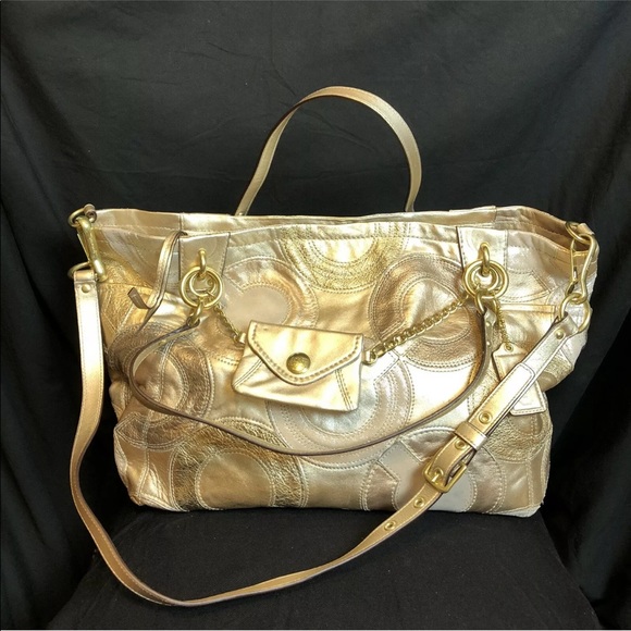 Coach Handbags - Coach Logo Tote Gold Silver Metallic New with Tags.
New without tag
Retail $498
